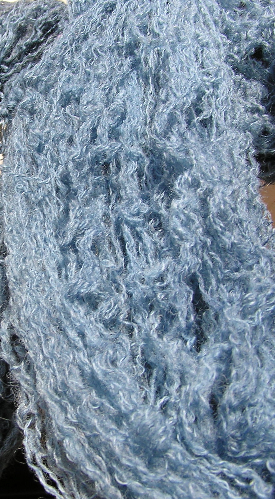 Wool in an indigo bath, freshly dipped and oxidising