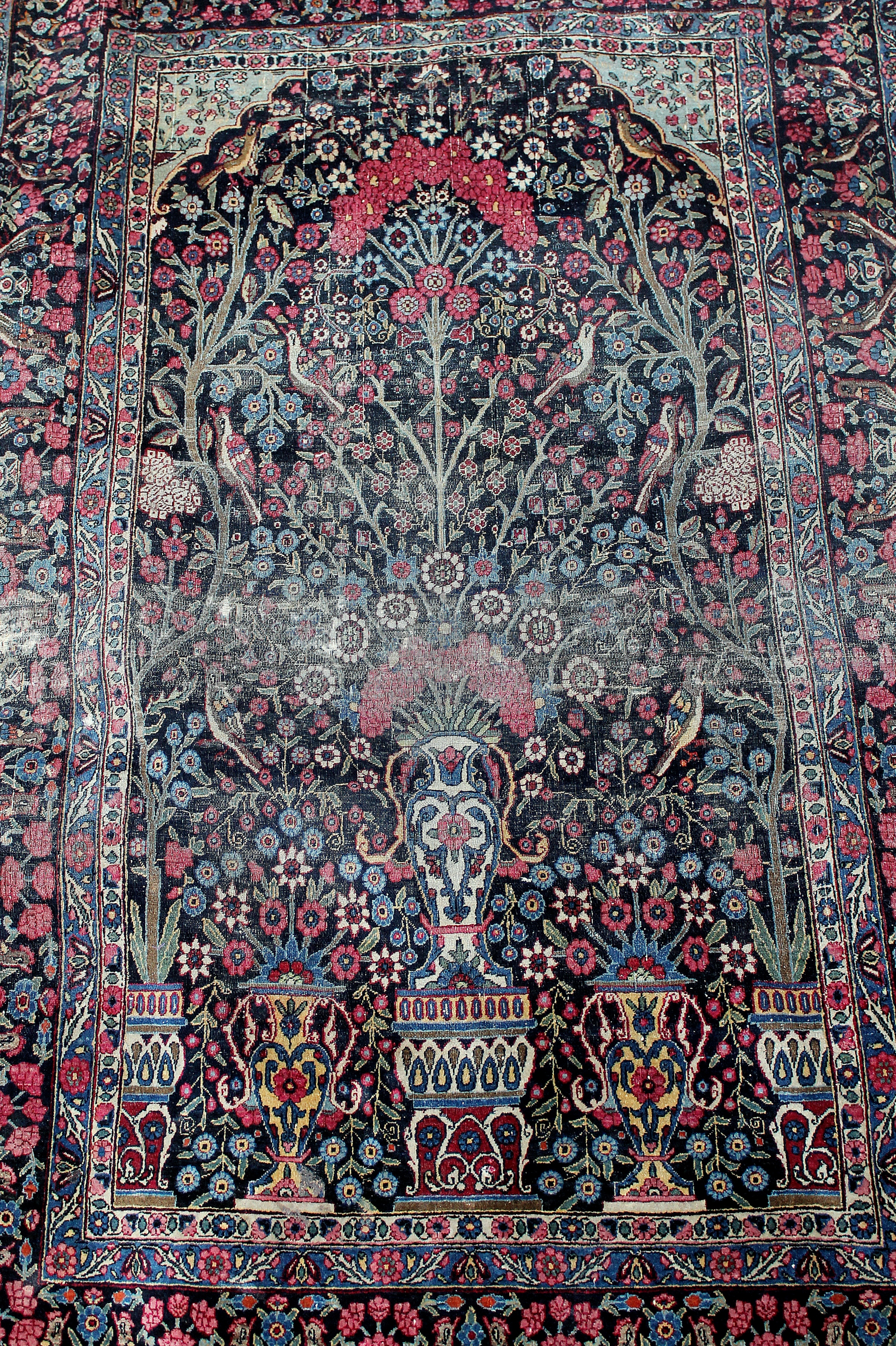 Tree of life motif with birds in a Persian rug